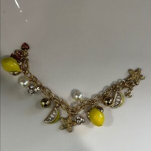 Yellow and Gold Charm Bracelet with Intricate Designs